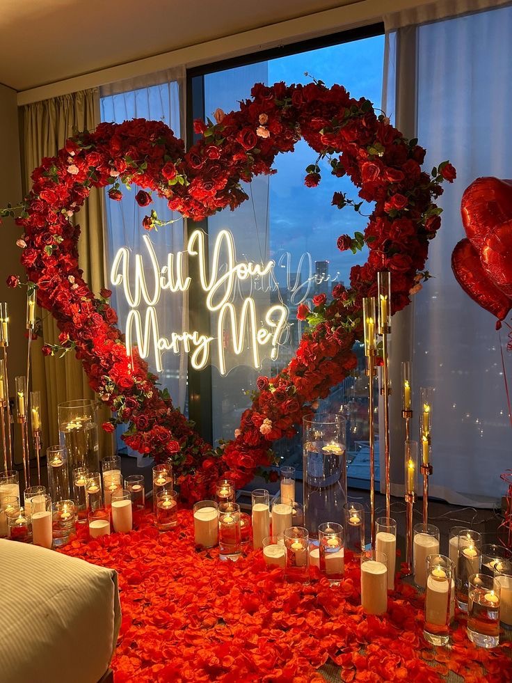 LED Acrylic ‘WILL YOU MARRY ME’ Lights with Red Heart-Shaped Foil Balloons, Artificial Red Petals, Artificial Heart-Shaped Flower Arrangement and White Candles in Small Glass Cylinder - Proposal Perfect for special occasions