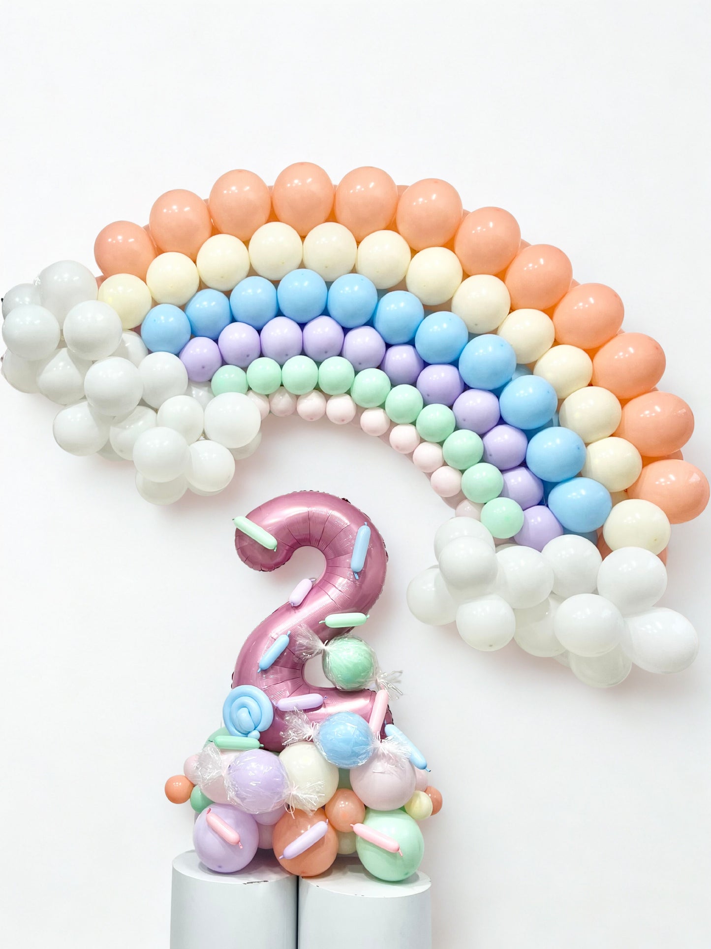 Platform Pink Number ‘2’ with Designed Candy with Customized Rainbow with Clouds Balloons Peach, Yellow, Blue, Purple, Mint Green, Pink and White - Customizable Design Sweets-Themed
