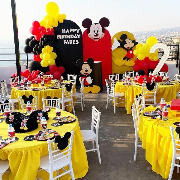 Customizable Backdrop, LED Marquee Number ‘2’, Cake Stand and Mickey Mouse Standee with Balloons Black, Read and Yellow Decor Setup - Perfect for special occasions