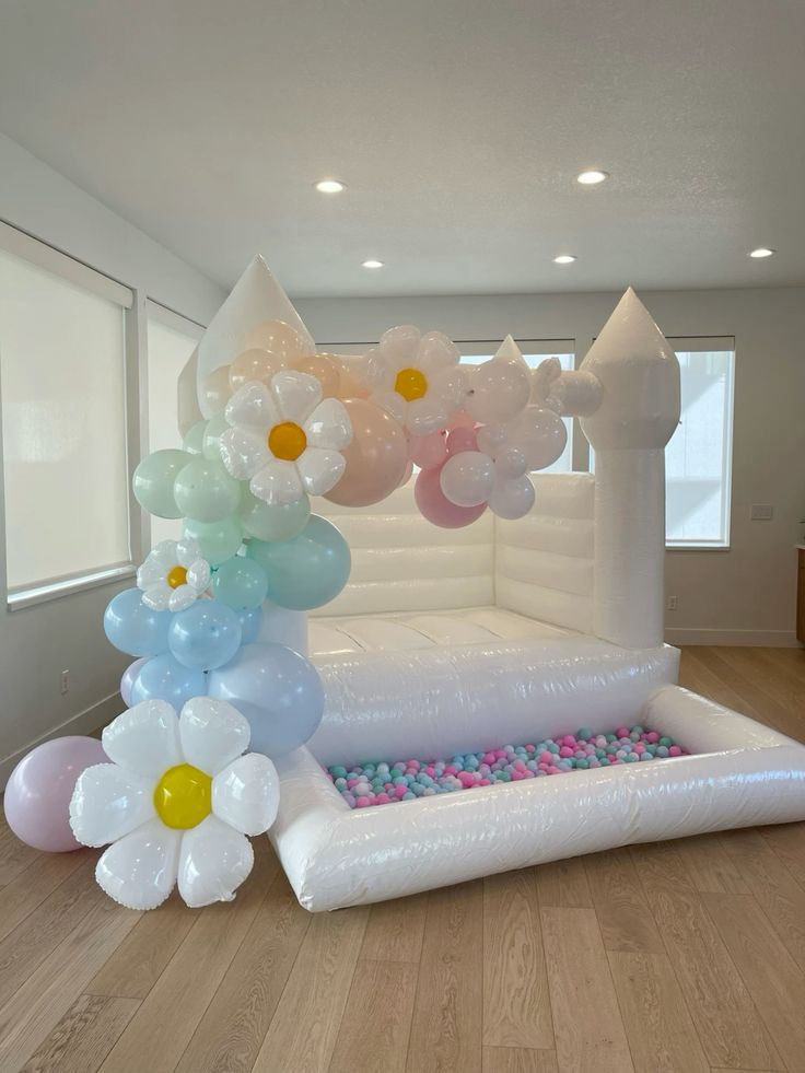 Bouncing Castle Rental 4x4m with Pit Balls and Balloon Decor Pink, Green, Purple, Blue and Peach with Daisy Flowers accents - Perfect for Birthday!
