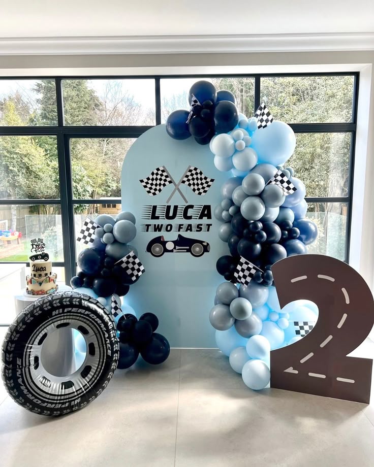 Customizable KT Board with Different Shades of Blue with Number ‘2’ Standee and Wheels Accents and Cake Stand Car-Themed Decor Setup - Perfect for special occasions