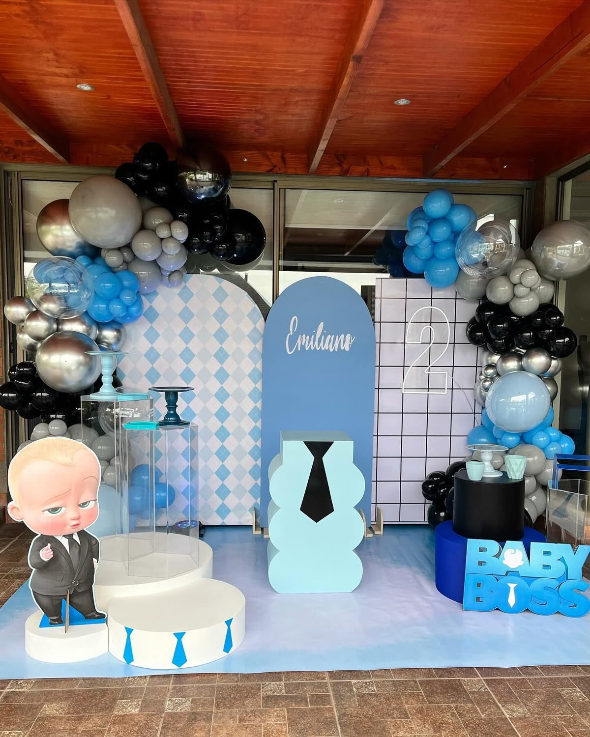 Customizable Backdrop with Balloons Clear, Black, Gray and Silver with Baby Boss Standee, Acrylic Cake Stand and LED Marquee Number ‘2’ - Boss Baby-Themed Perfect for special occasions