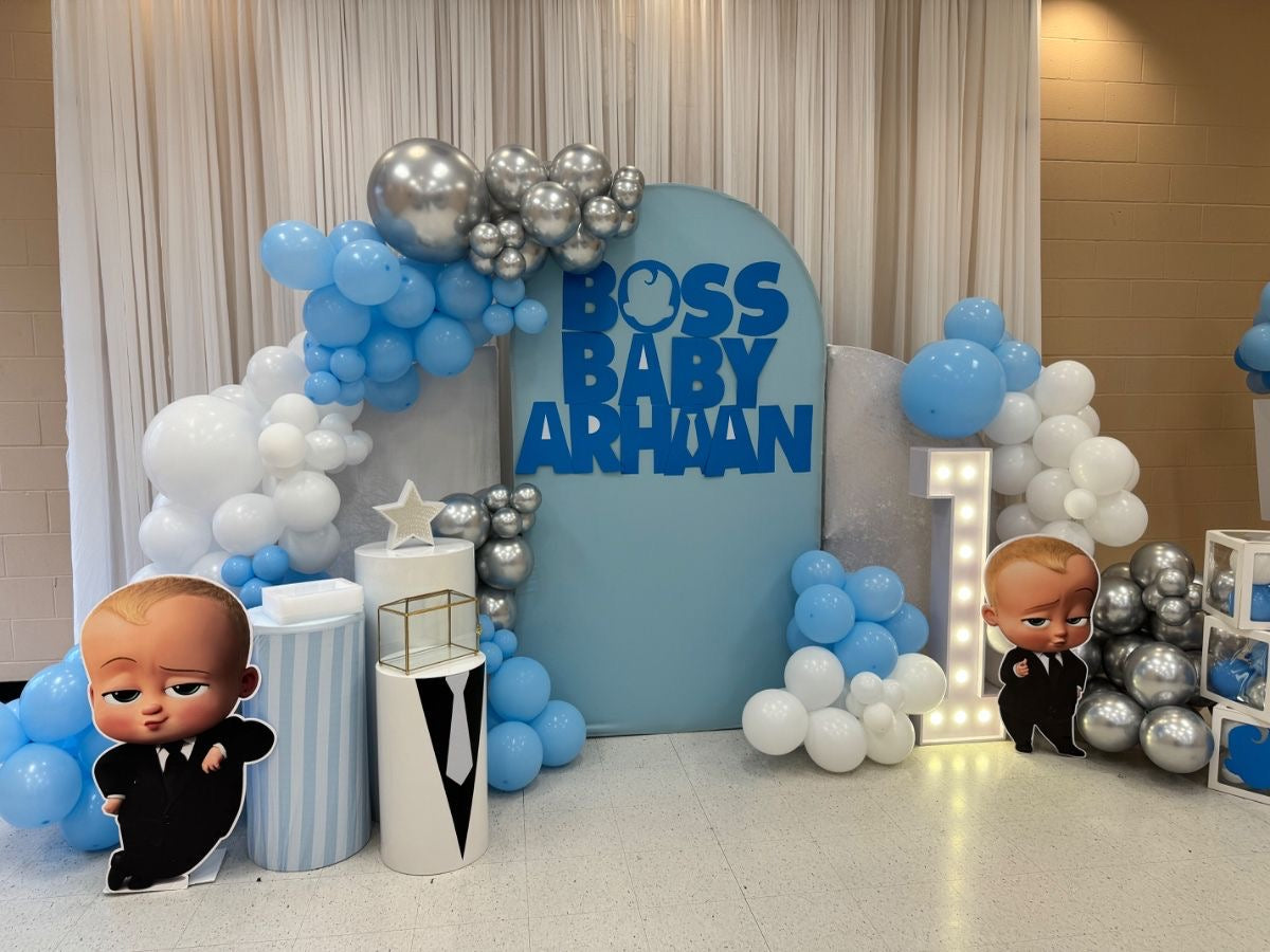 Customizable Backdrop with Balloons White, Blue and Silver with Baby Boss Standee, Cake Stand and LED Marquee Number ‘1’ - Boss Baby-Themed Perfect for special occasions