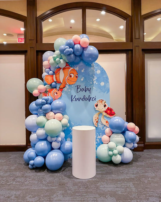 Customizable Board Backdrop with Balloons Blue, Green, Purple and Pink with Nemo Characters and White Cake Stand - Nemo-Themed Perfect for special occasions