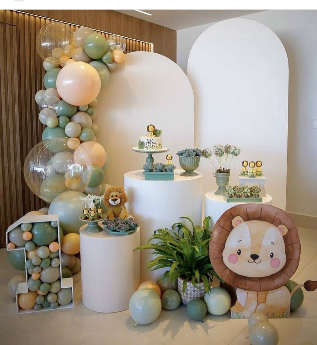 Customizable Board Backdrop with Balloon Green, Beige and Clear with Number ‘1’ Marquee, Lion Standee - Safari-Themed Perfect for special occasion