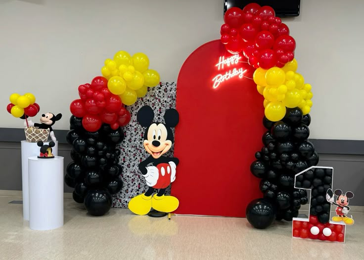 Customizable Backdrop, LED Acrylic ‘Happy Birthday’, Number ‘1’ with Balloons, Cake Stand and Mickey Mouse Standee with Balloons Black, Read and Yellow Decor Setup - Perfect for special occasions
