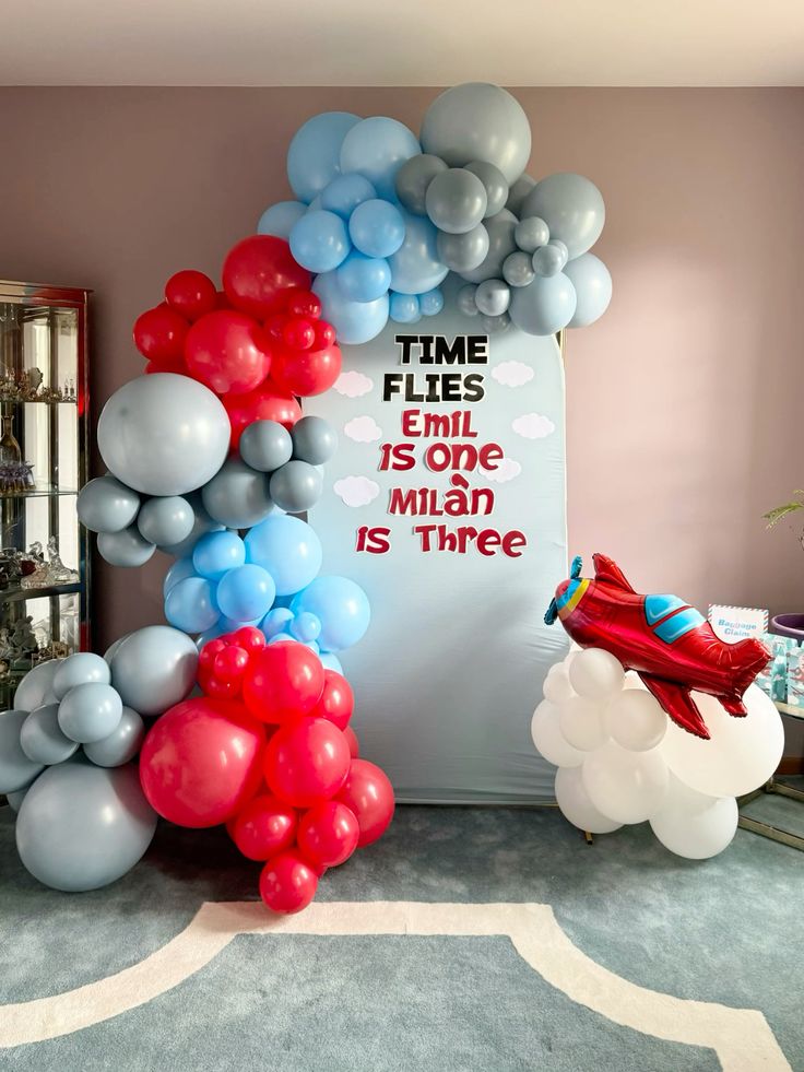 Customize Board Backdrop with Balloon White, Gray, Blue and Red with Plane Foil accents Aircraft-Themed Decor – Soar Into Celebration!