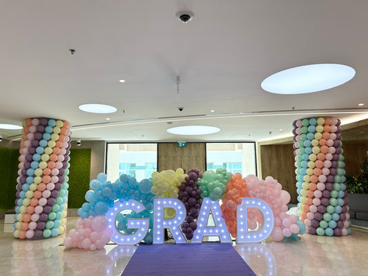 LED Letters Marquee “GRAD” with Organic Balloons Mint Green, Peach, Pink, Blue and Purple Arrangement and Pillar Post - Perfect for Graduation