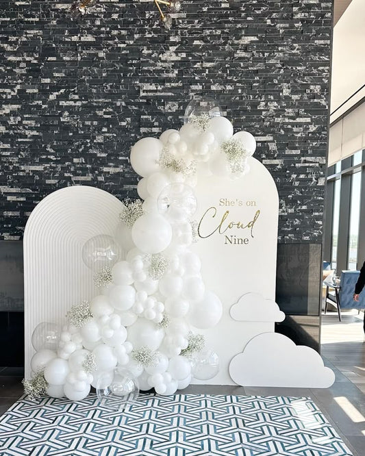 Customizable Board Backdrop with White, Clear Balloons 'She's on Cloud Nine' and Artificial Flowers - Perfect for 9th Birthday Celebration!