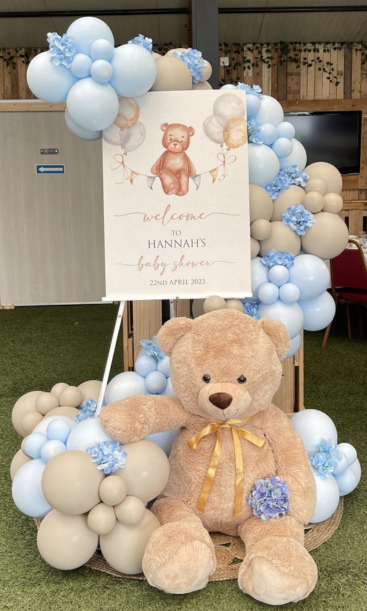 Customizable Canvas with Wooden Stand Welcome Board, Organic Balloon Blue and Beige Chain Arrangement with Artificial Flowers and Teddy Bear - Perfect for any occasions!
