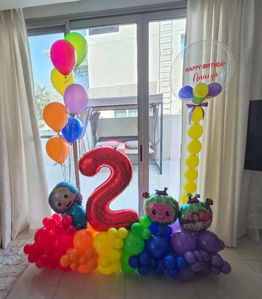 Platform Red Number '2' with Latex Blue, Green, Orange, Yellow, Purple, Red with Cocomelon and Designed Rainbow Balloons accents and Personalised Clear with Mini Latex with Customized Sticker and Helium Latex Bunch – Cocomelon-Themed Customizable Design