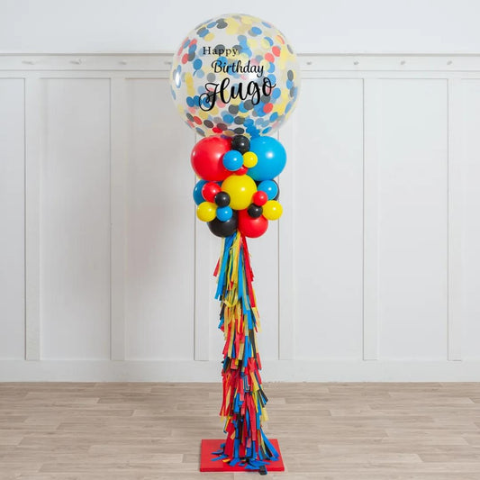 Personalised Clear Balloon with Blue, Black, Yellow, and Red Confetti and Tassel-Accented Balloon Pillar/Column/Tower – Perfect for Any Bold and Festive Celebrations