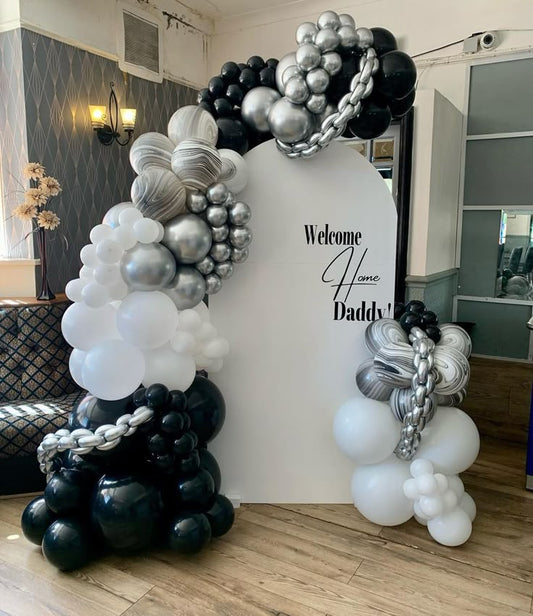 Customizable Board Backdrop 'Welcome Home Daddy' with Balloons White, Black and Silver - Perfect for any celebration!