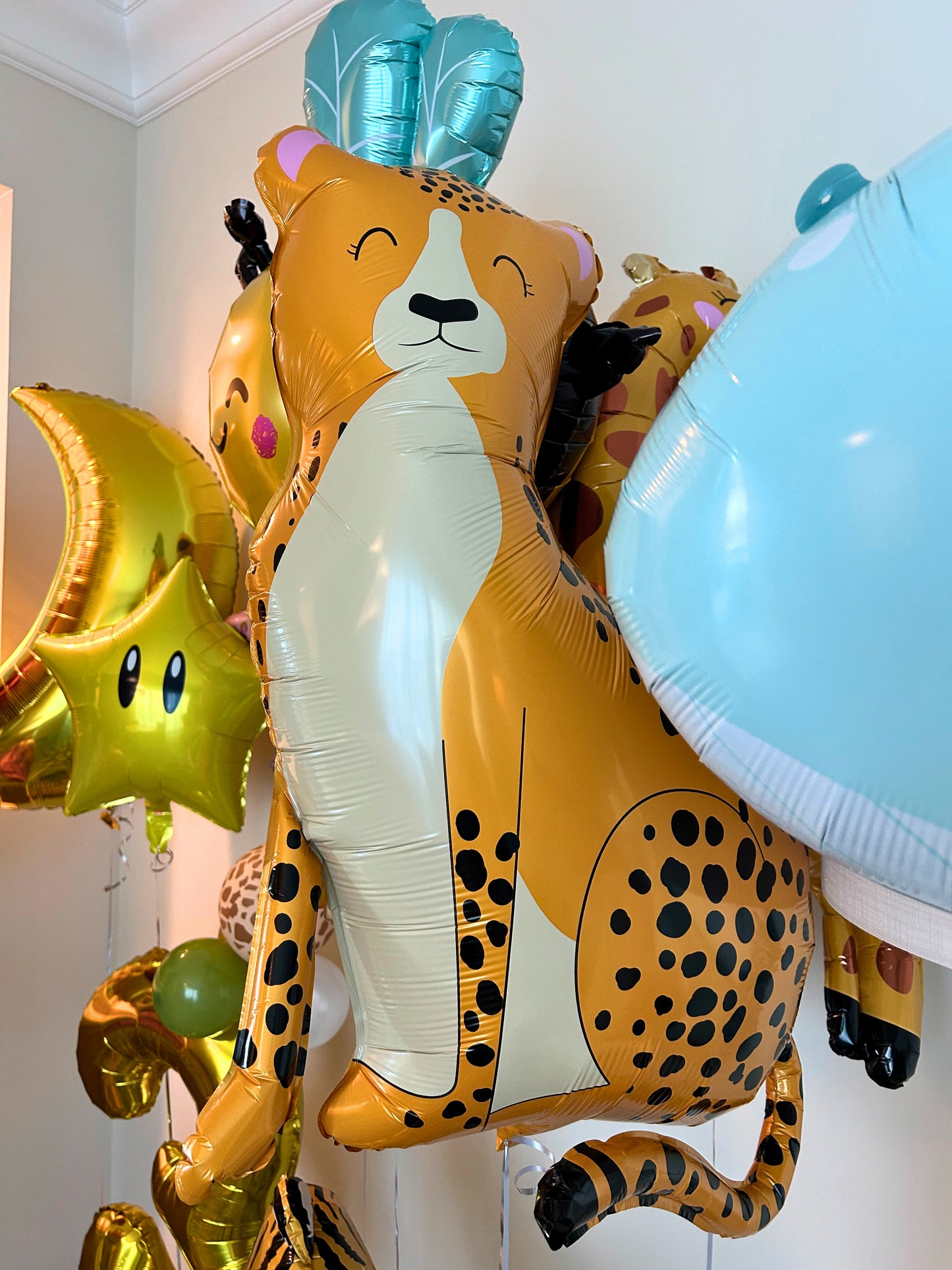 Safari Animals Number Stand with Animal Print Balloon Design and Animal Helium Balloons with Star and Moon Accents - Perfect for Any Safari Themed Celebrations