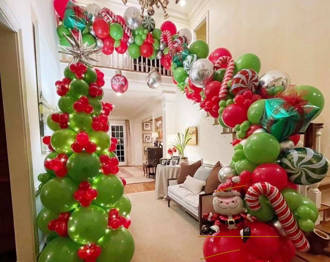 Christmas Balloon Garland and Tree Display with Candy Canes, Metallic Balloons, Star Decorations, Red, Green, and Gold Ornament Accents, and a Balloon Christmas Tree with LED Lights