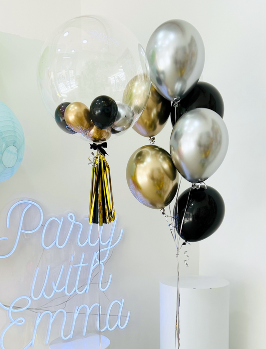 Transparent Balloon Display, Featuring Mini Balloons Inside, Gold Tassels, and Black, Gold & Silver Helium Balloons Bouquet