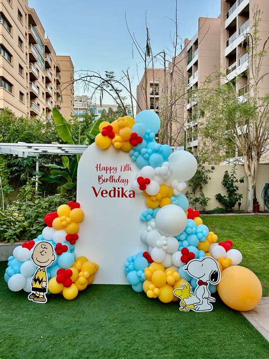 Customizable Board Backdrop with Balloon Blue, Red, Yellow and White Decor Setup - Snoopy-Themed Perfect for special occasions