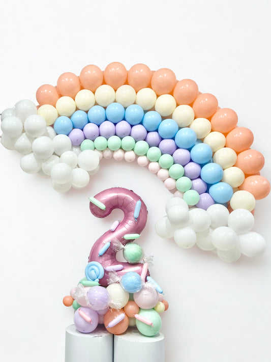 Platform Pink Number ‘2’ with Designed Candy with Customized Rainbow with Clouds Balloons Peach, Yellow, Blue, Purple, Mint Green, Pink and White - Customizable Design Sweets-Themed