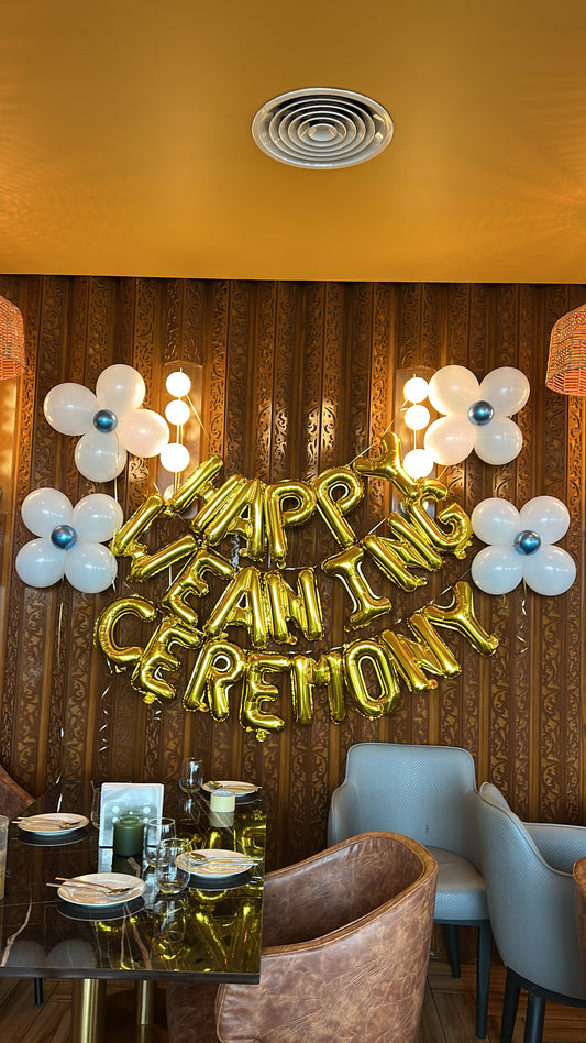 Gold Letter Banner “HAPPY WEANING CEREMONY” with Blue and White Flower Designed Latex accents - Perfect for special occasion!