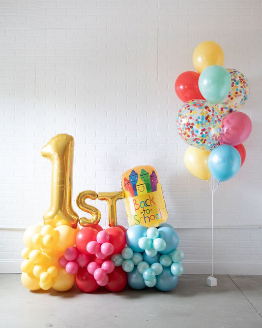 Platform Gold Number '1' with Latex Pink, Yellow and Blue with 'Back To School' Foil, Gold Letters 'st' and Latex Helium Bunch with 18-inch Clear with Confetti – Customizable Design