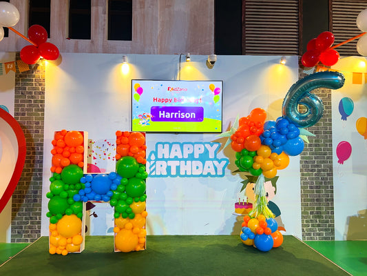 Customize Letter Stand with Latex Balloons Orange, Green, Yellow and Blue Decor and Customize Pillar/Column/Tower with Number Blue ‘6’ and Tassel accents - Perfect for special occasion!