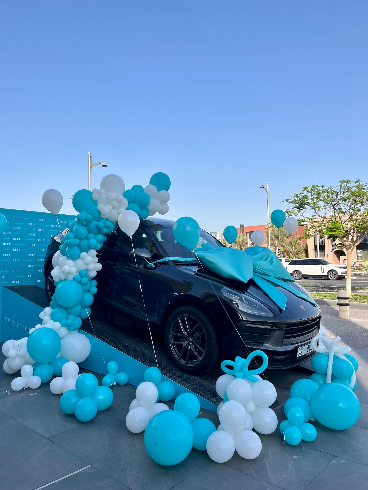 Balloon Design Colors Turquoise and White with Gift Box Balloon Decor – Perfect for Any Company Car Launch or Car Surprise Celebrations