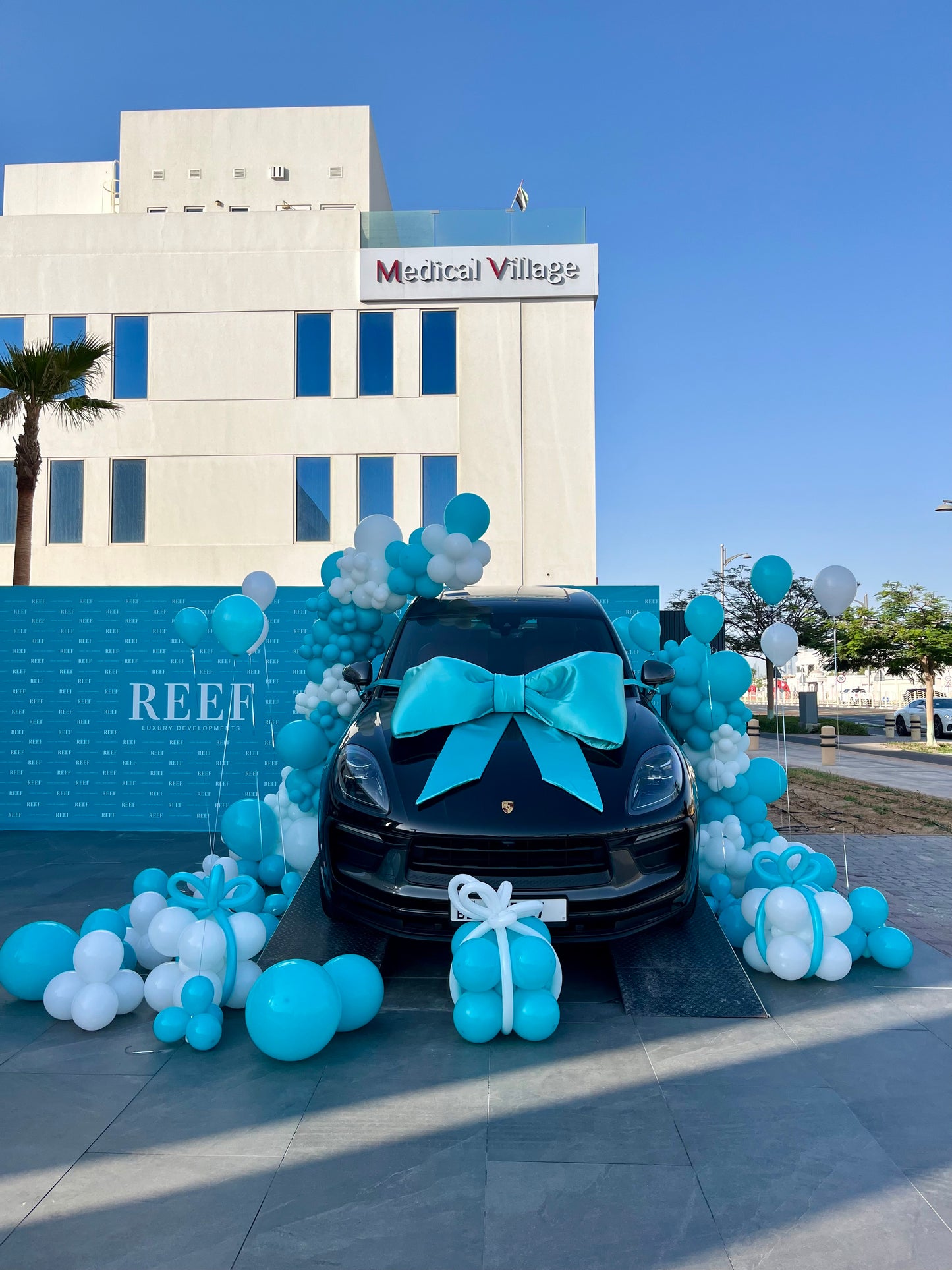 Balloon Design Colors Turquoise and White with Gift Box Balloon Decor – Perfect for Any Company Car Launch or Car Surprise Celebrations