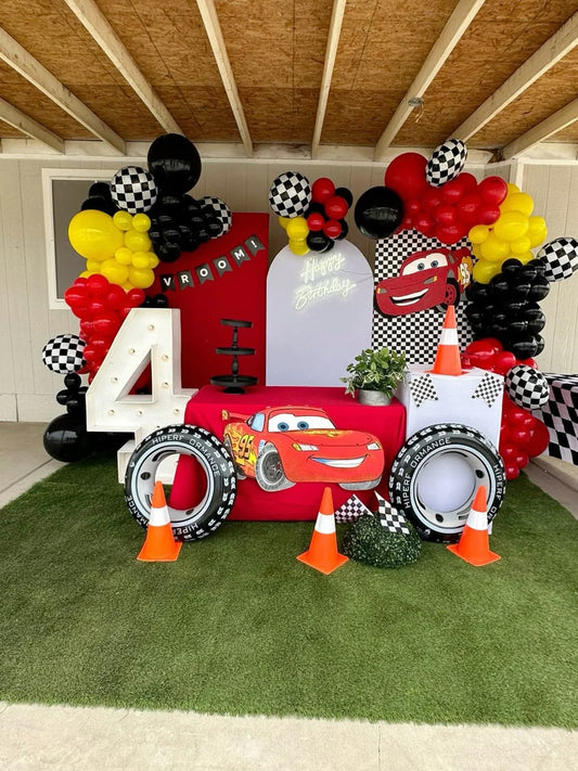 Customizable Backdrop with Balloons Yellow, Red and Black with Cars Character, Wheels and Checkered Ball Foil Accents and LED Marquee Number ‘4’, LED Acrylic ‘Happy Birthday’ Lights - Cars-Themed Perfect for special occasions
