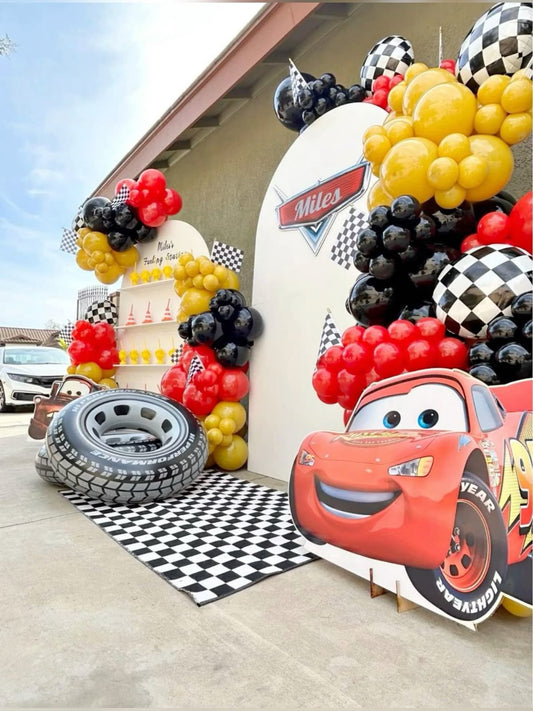 Customizable Backdrop with Balloons Yellow, Red and Black with Cars Character, Wheels and Checkered Ball Foil Accents and Cars Standee - Cars-Themed Perfect for special occasions