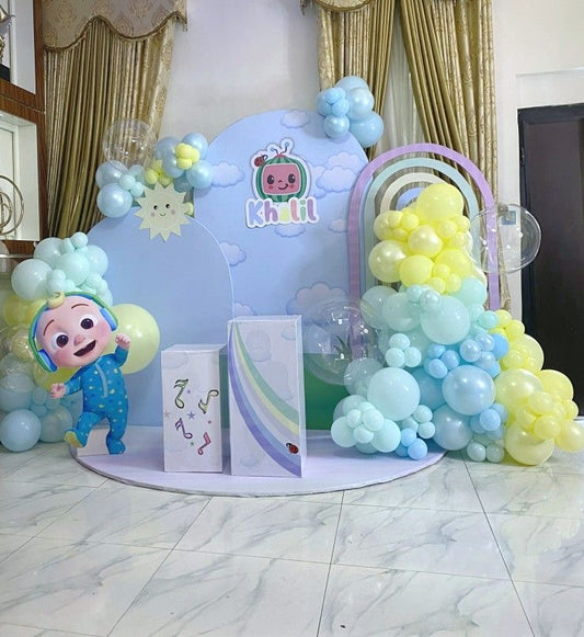 Customizable Board Backdrop with Balloon Blue, Yellow and Clear with JJ Character Standee and Cake Stand - Cocomelon-Themed Perfect for special occasions