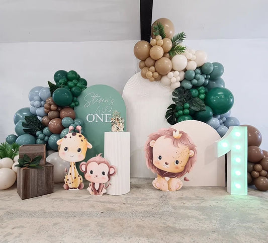 Customizable Board Jungle Backdrop with Balloon Brown, Sand White, Green, Beige and Blue with Artificial Leaves, LED Marquee ‘1’ Number, Animals Standee Lion Giraffe Monkey - Safari-Themed Perfect for special occasions