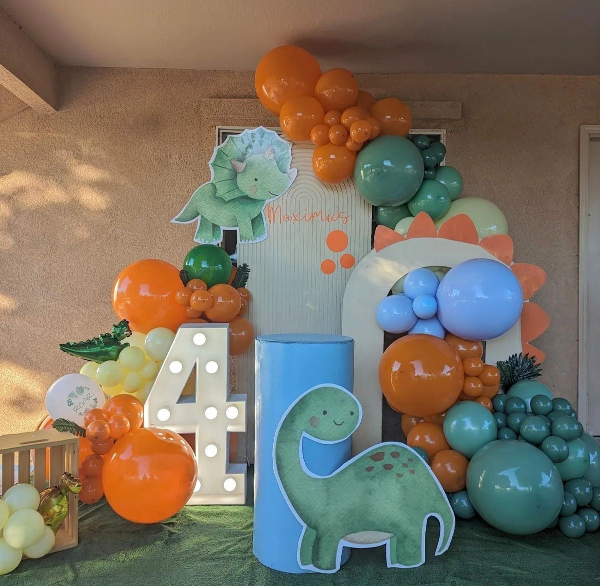Customizable Board Backdrop with Balloon Orange, Green, Yellow and Blue with Dinosaur Standee and LED Marquee ‘4’ Number - Dinosaur-Themed Perfect for special occasion