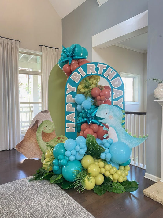 Customizable Board Backdrop with Balloon Green, Blue and Muave with Artificial Leaves and Blue Star Accents and Dinosaur Balloon Standee - Dinosaur-Themed Perfect for special occasion