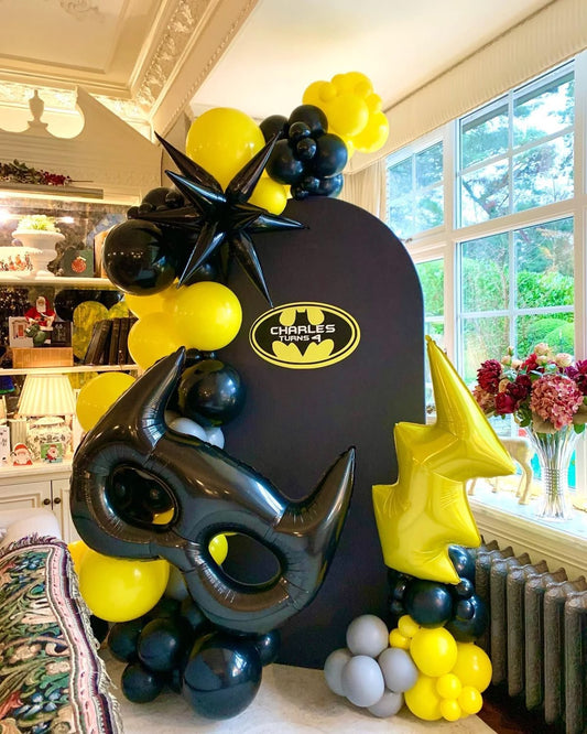 Customizable Board Backdrop with Balloons Yellow, Black and Gray with Stars and Lightning Accents - Batman-Themed Superheroes Perfect for special occasions