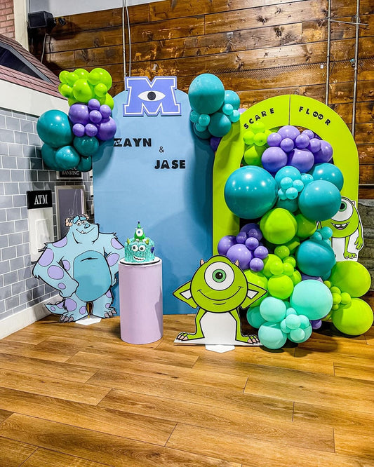 Customizable Board Backdrop with Balloon Turquoise, Green and Purple with Mike and James Standee in Cake Stand  - Monster, Inc.-Themed Perfect for special occasions