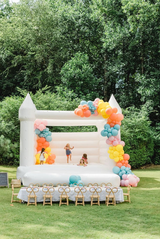 Bouncing Castle Rental 4x4m with Pit Balls and Balloon Decor Pink, Yellow, Blue and Peach - Perfect for Birthday!