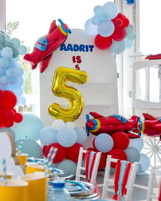 Customize Board Backdrop with Balloon White, Blue and Red with Balloon on Stand Plane Foil and Gold Number '5' Helium accents Aircraft-Themed Decor – Soar Into Celebration!