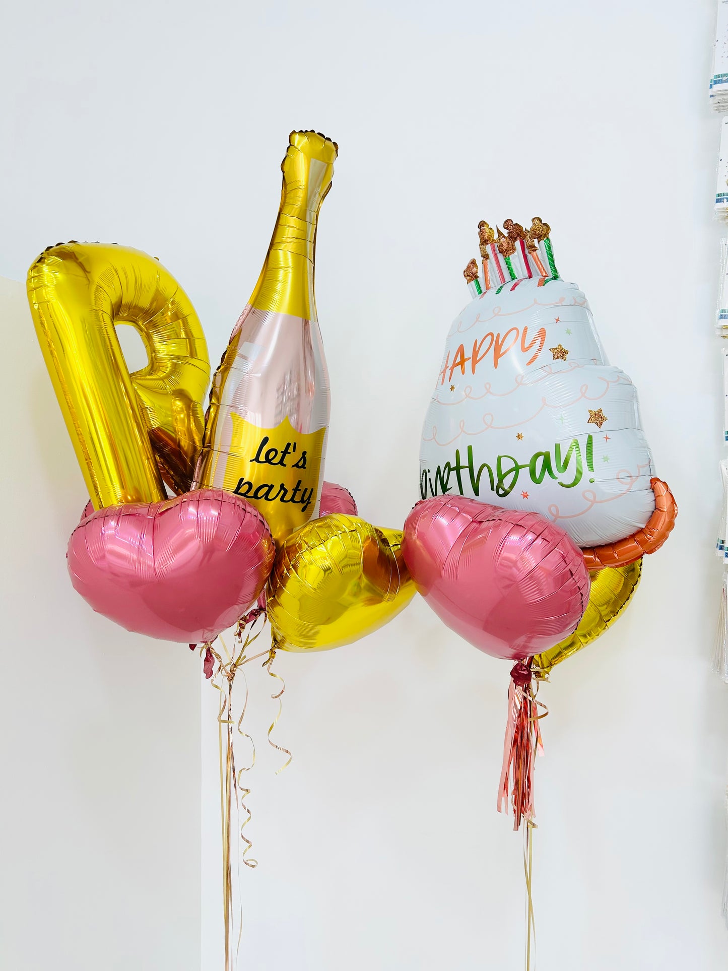 Helium Gold Single Letter Set Balloon with 'Happy Birthday' Foil Balloon, 'Champagne' Foil Balloon and Foil Star Balloons Accents