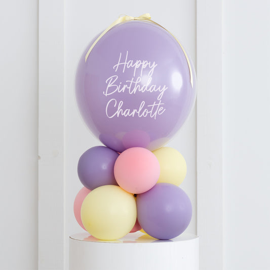 Personalised Birthday Bobo Balloon on Stand - Pink, Pastel Purple, Yellow Clusters with Custom Name Sticker